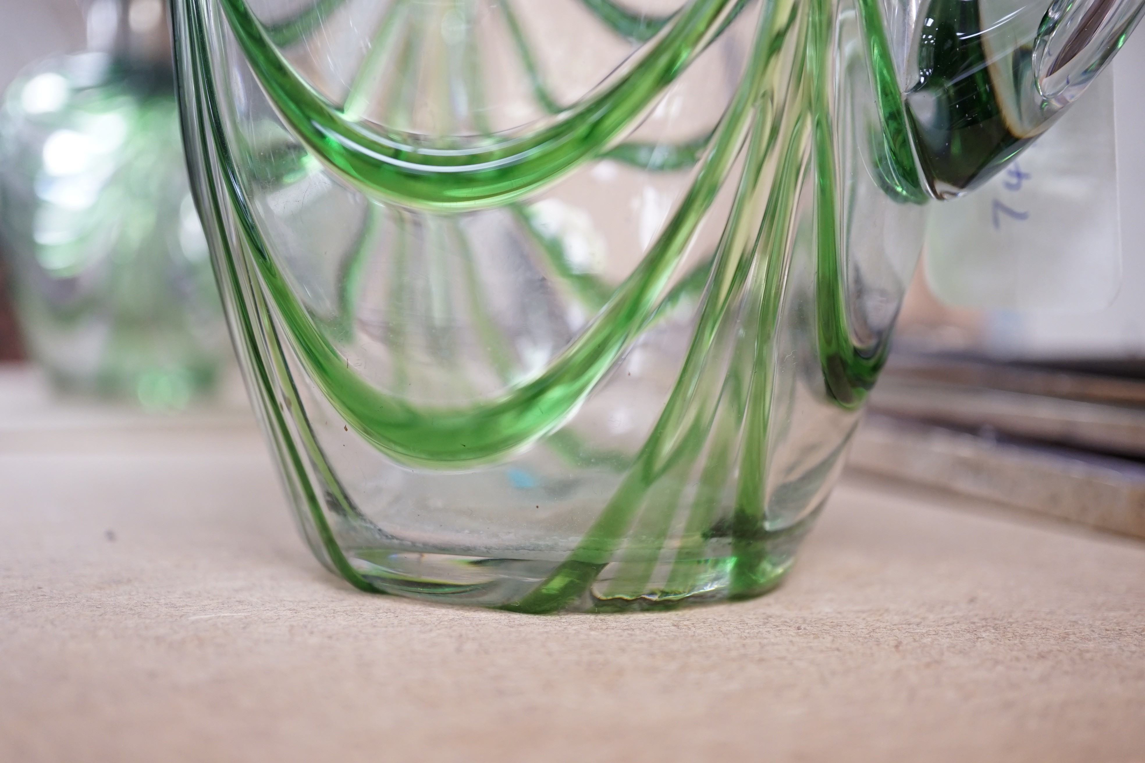 A late Victorian Art Nouveau silver mounted glass claret jug and stopper, D & M Davis, Birmingham, 1900, the glass with ribbed green swags, height 20.7cm.
